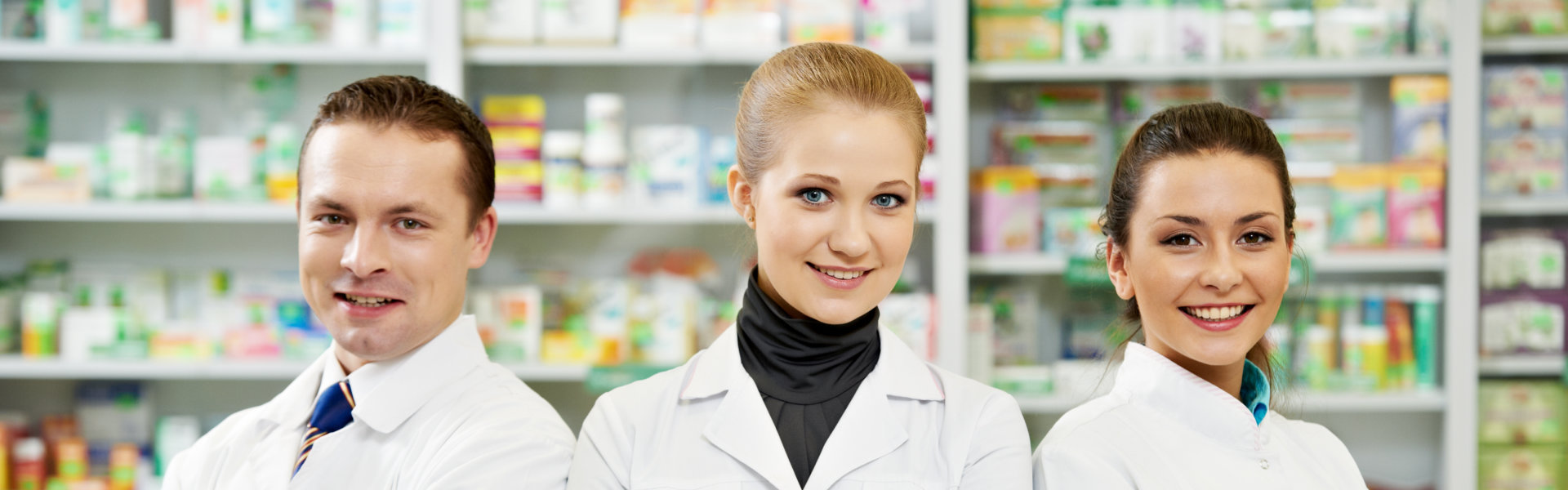 three pharmacist smiling at the camera